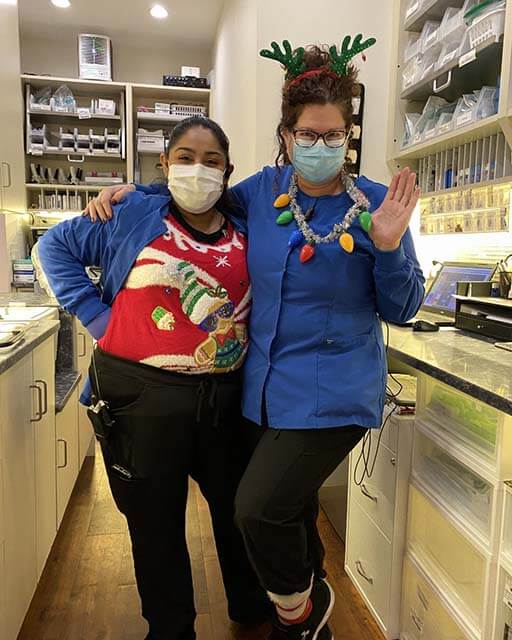 Dulce And Tammy Wearing Ugly Christmas Sweaters At Susan Dennis Dds