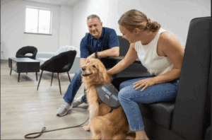 Two people with a dog