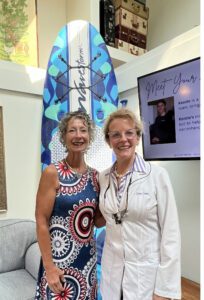 Dr. Dennis with Judi, the winner of a 2nd quarter giveaway- a kayak